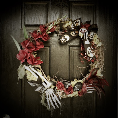 Halloween Wreath - red roses, skeleton hands, skull ribbon, skull, and moss