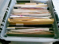 Scrapbook items ready to scrapbook in hanging file box