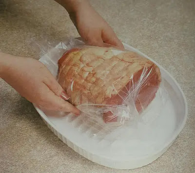 image of covering meat by cling film