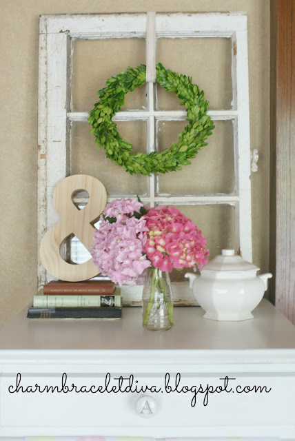 pink hydrangeas in vintage milk bottle