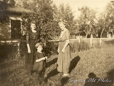 Women and child in the yard DL Antiques