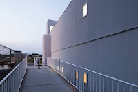 Shiga Narrow Urban Promenade House Design With Concrete Walls And Upper Bridge