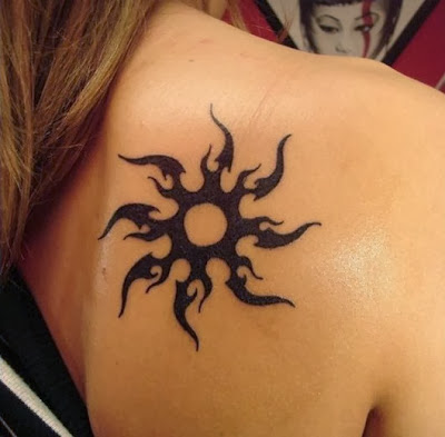 sun tribal tattoo on back