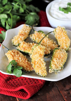 Baked Jalapeno Poppers Image - Filled with a tasty combination of sharp cheddar, cream cheese, and flavorful spices, Baked Jalapeno Poppers pack a wonderfully delicious spicy punch without the fat of frying.