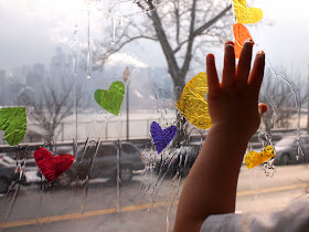 stick your cellophane pieces to the window with dish soap