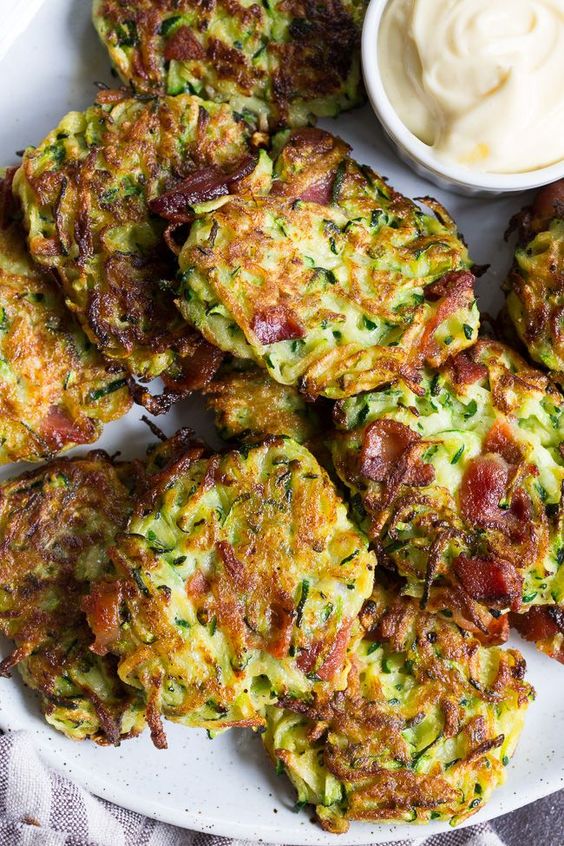 These savory bacon zucchini fritters are easy to make, packed with veggies and downright addicting! They're delicious served as a side dish or appetizer with homemade ranch dip