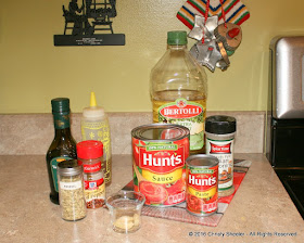 All the ingredients for pizza sauce are set out on the counter.