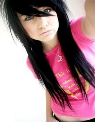 emo girl with black and blue hair. Black hair makes lue eyes pop