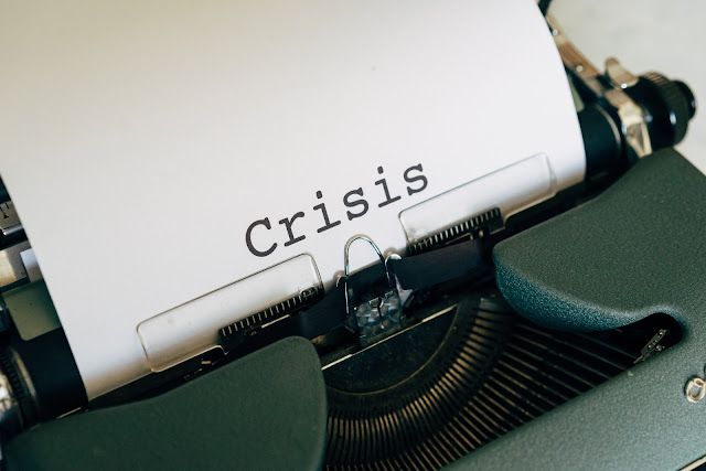 "Crisis" word printed out of a typewriter - Economic Crisis due to COVID-19