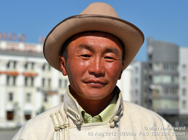 people, portrait, headshot, street portrait, Mongolia, Ulaanbaatar, Chinggis Khaan Square, Mongolian man, traditional Mongolian costume, Mongolian deel