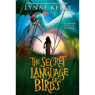Book cover for The Secret Language of Birds shows a girl with a flashlight and a whooping crane in the background
