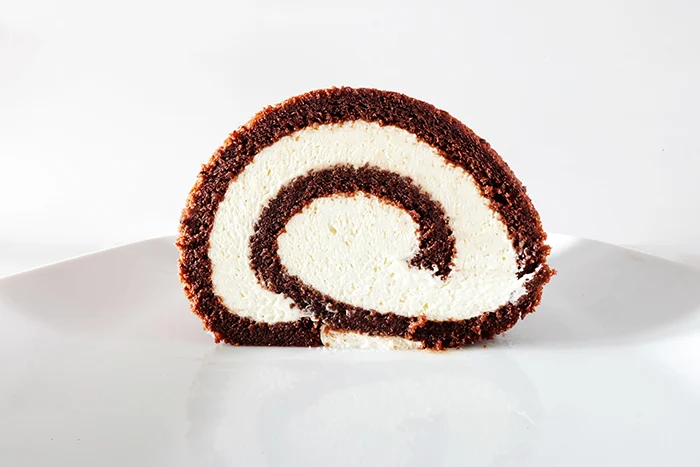 side view of sliced Chocolate Swiss Cake Roll