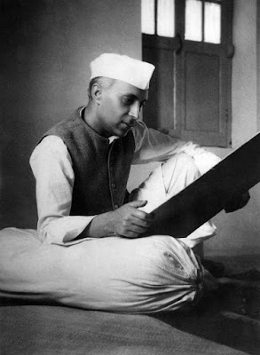 Nehru reading something