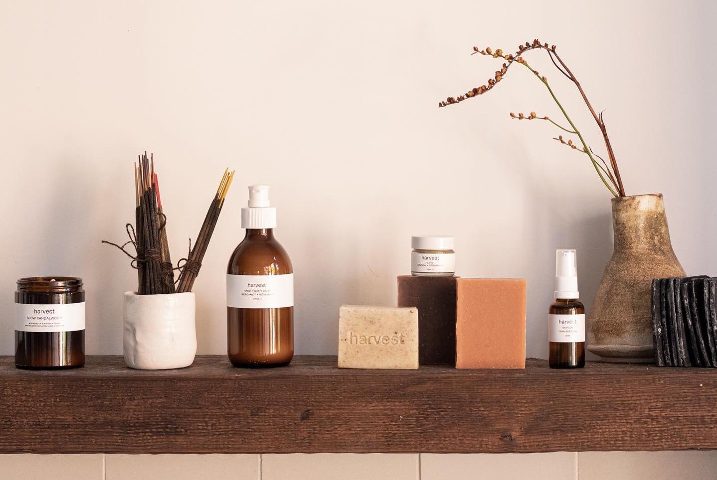 A selection of bottles and jars filled with beauty products from Harvest skincare