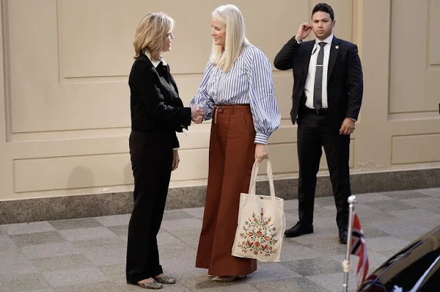 Crown Princess- Mette-Marit wore a fringed jacquard jacket by Chloe, and an Evie embroidered cotton midi dress by Erdem