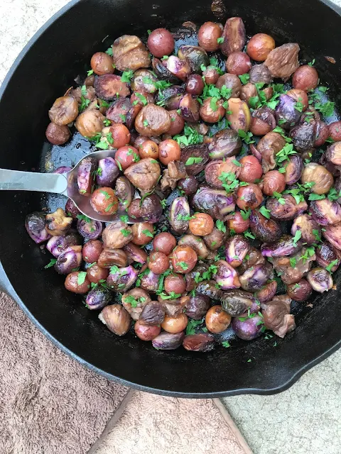 Skillet of Brussels with grapes and chestnuts.