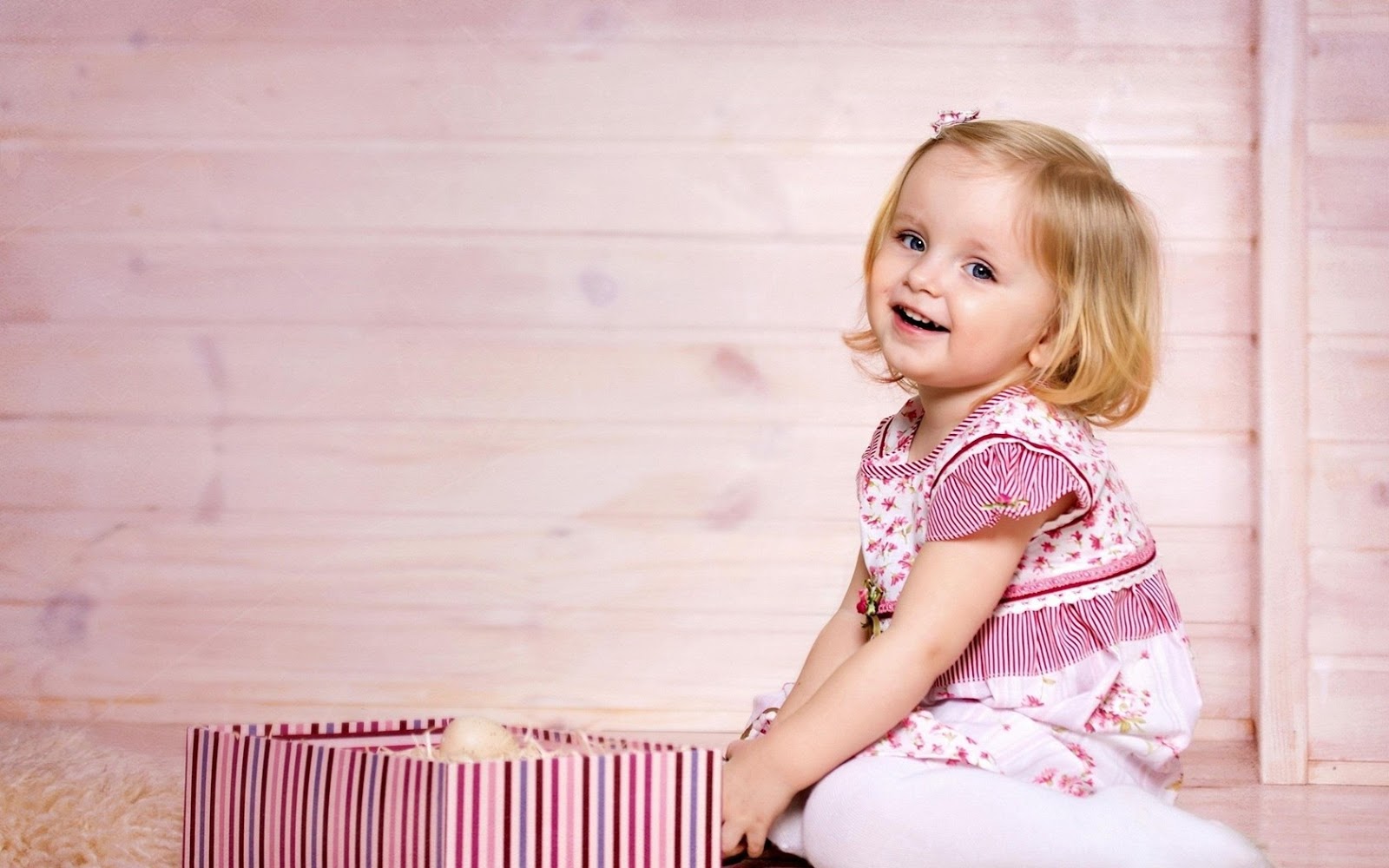 Happy Little Sly Baby Girl In Bright Multicolored Festive ...