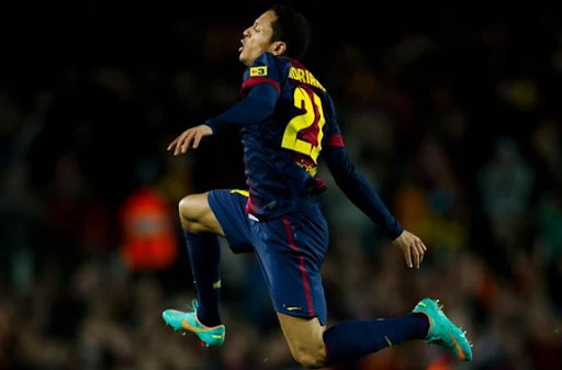 Barcelona player Adriano celebrates after scoring the equaliser against Atlético Madrid