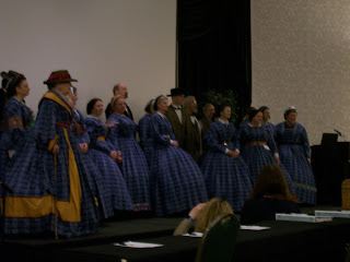 Symposium faculty in their blue dresses.