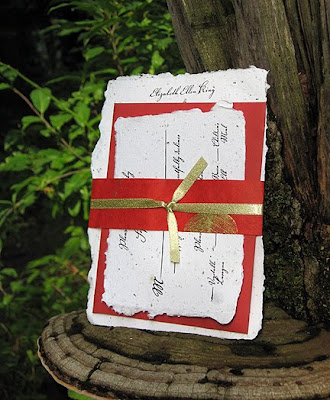 The Invitation And Response Card Are Held Together With A Handmade Red Paper
