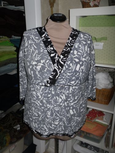 The back neckline has a self-fabric turned-down binding as a facing.