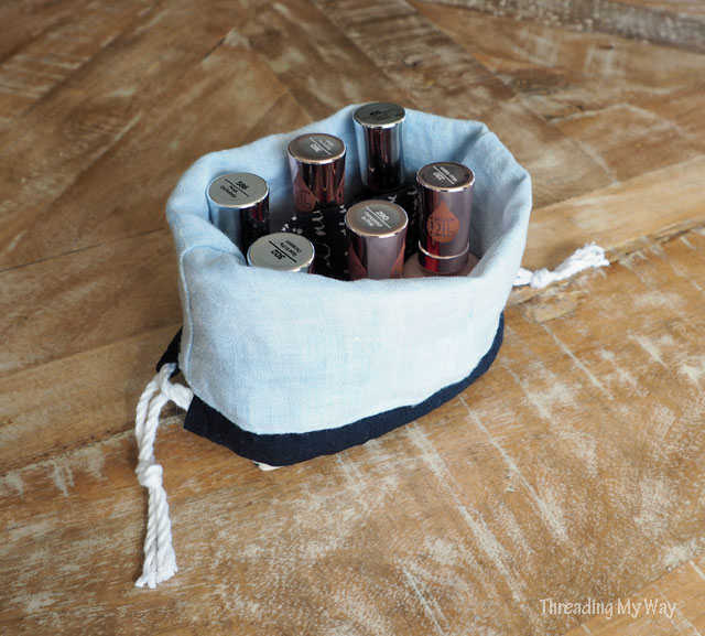 Make a drawstring bag, complete with divider, to hold nail polish. Tutorial by Threading My Way.