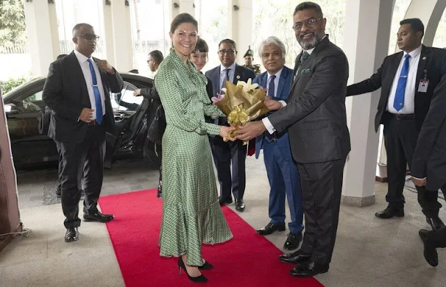 Crown Princess Victoria wore an Olga dress by Dea Kudibal. The Crown Princess arrived at the InterContinental Hotel in Dhaka