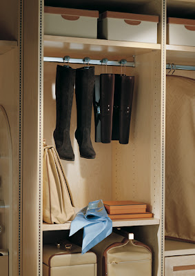 boots hanging in a closet