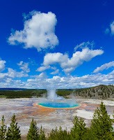 Steam rising from a beautiful, colorful hot spring