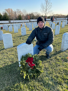Staff Sergeant Mickey L. Jaramillo, a Marine who was HM1 Jonathan Shumaker’s mentor at his first duty station, is among those buried at Arlington National Cemetery. Shuman,  the USU Joint Enlisted Association, and other USU volunteers laid wreaths on graves across the cemetery, Dec. 14, 2024. (Courtesy photo)