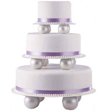 Three tier wedding cakes decorated with glass accessories