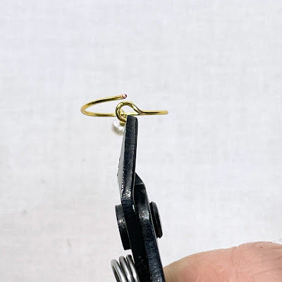 Trimming the catch on DIY wire hoop earrings