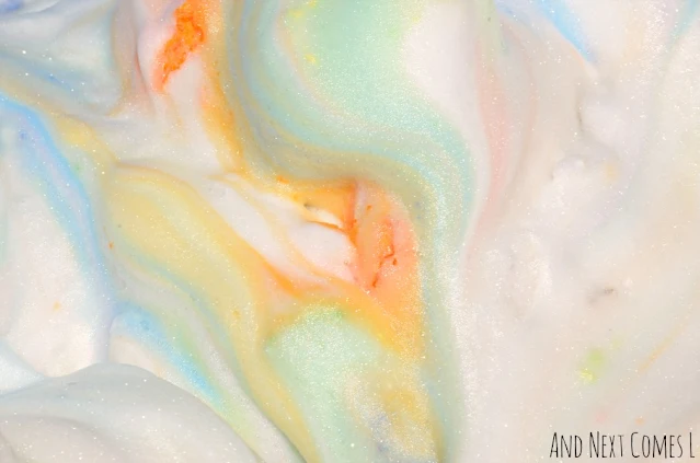 Close up of colored shaving cream sensory play