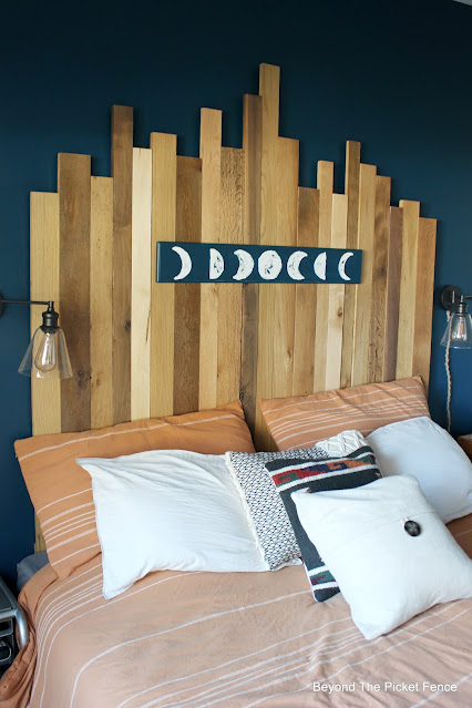 Reclaimed Wood Headboard and Moon Sign for a Rustic Boho Bedroom