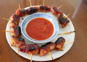 Food Lust People Love: If you are looking for an easy appetizer that will disappear in record time, may I suggest these sweet and spicy bacon cocktail sausages! With chili sauce and bacon wrapped around little sausages they are then topped with brown sugar and baked till sticky.   An easy but delicious appetizer with bacon, cocktail sausages and chili sauce. Highly addictive. Be warned.