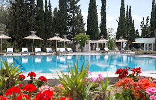 outdoor pool area from an evia hotel