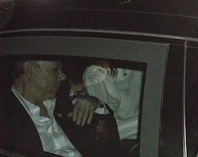 Colombian President Juan Manuel Santos heads off into the night after his re-election victory speech.