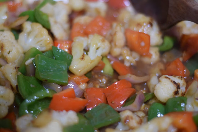 The sauce poured over the vegetables in the pan to thicken. 