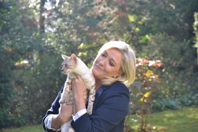 Marine Le Pen loving being with a cat