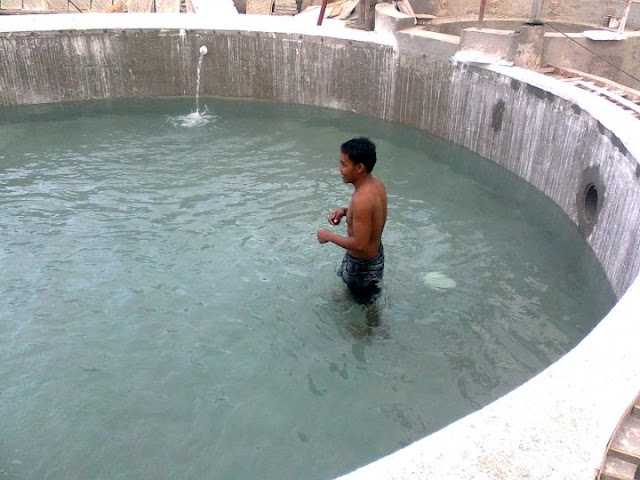 Our worker taking the first dip in the hot spring water
