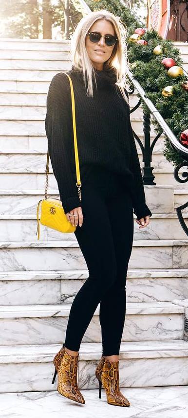 trendy outfit idea: black knit + skinnies + yellow bag + animal printed heels