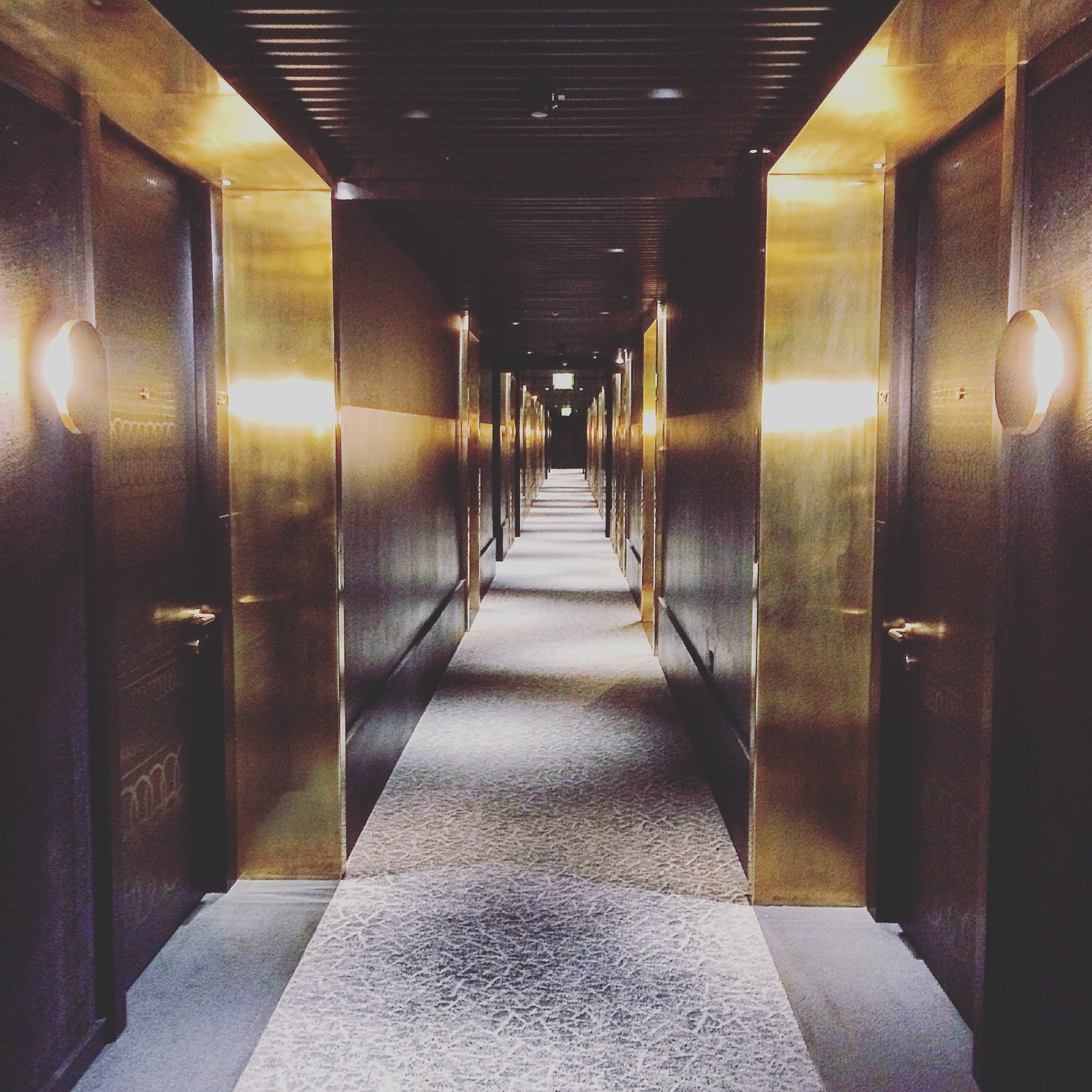 grey carpeted hallway at london nobu hotel shoreditch
