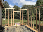 Home DIY (do it yourself) addition construction exterior wall framing with window