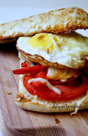 Pan roasted vegetables and fried egg sandwich on gluten free ciabatta