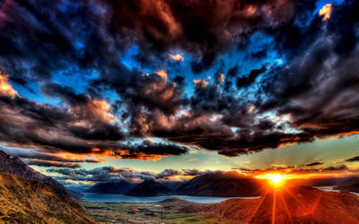 Puesta de sol junto al lago y el cielo nublado - Sunset