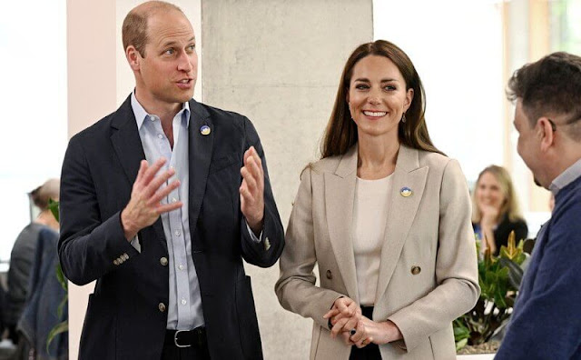 Kate Middleton wore a cream double-breasted blazer from Reiss, and black leather pumps. Kiki McDonough Citrine pear drop earrings