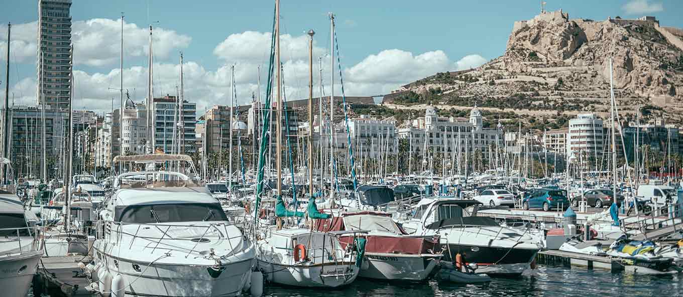 Close up photo of the many boats and yachts in Alicante harbour, Spain.