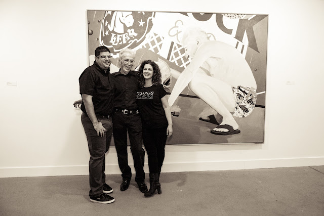 Theo Wujcik with Tracy Reller in front of one of his paintings at Tempus