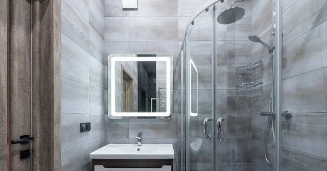 Luxury shower in gray stone bathroom.