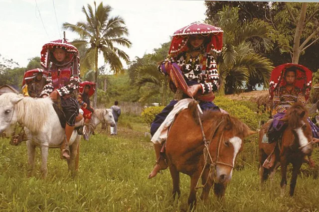 Tboli women riding horses
